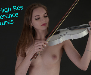 PRC106 - Model poses with a white violin