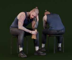 Reflective Moment - Man with Tattoos Sitting in Thought