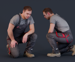 Focused Worker - Foreman Kneeling in Overalls