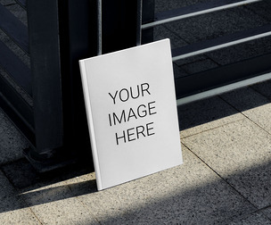Magazine Cover Mockup PSD Template Leaning Against Urban Fence