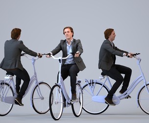 00029_Steven010 Adult Caucasian businessman cycling through public space in transitional seasonal