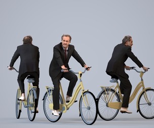 00053_PaulJan012 Adult Middle Eastern man cycling through public space in business attire