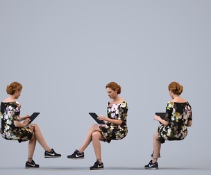00113_Halle002 Adult Caucasian woman reading tablet while sitting in public space