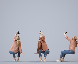 00128_Kiera011 Adult Caucasian woman sitting outdoors taking photo with smartphone