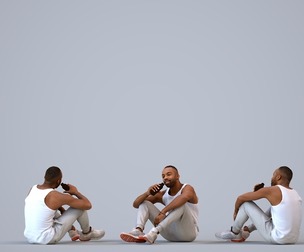 00182_Terrell011 Adult Black male sitting relaxed at home in casual summer attire