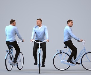00186_Eliot014 Adult Caucasian man cycling through public space in transitional seasonal clothing