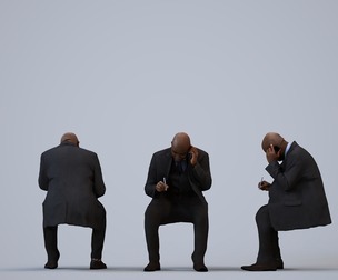 00218_Jon0010 Adult Black male sitting in office wearing autumn or spring business attire
