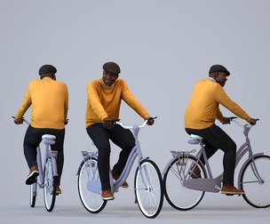 00220_Jon0016 Adult black man cycling through public space in transitional seasonal clothing
