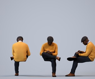 00220_Jon0012 Adult Black male sitting at home with smartphone in transitional seasonal clothing