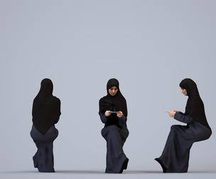 00243_Hannah0010 Adult Middle Eastern woman sitting with documents wearing abaya and hijab in