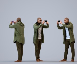 00285_Bill0010 Adult Black man taking photo in public wearing winter clothing