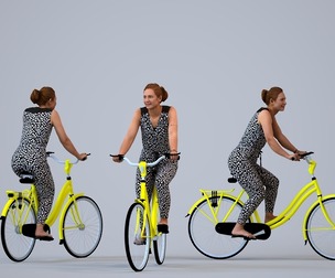 00286_Masha001 Adult Caucasian woman cycling through public space in casual summer attire