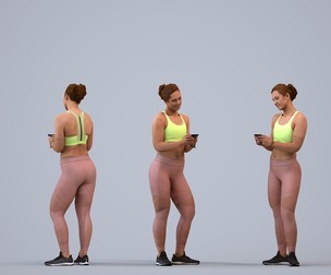00288_Misha008 Adult Caucasian woman standing in sportswear holding smartphone for fitness