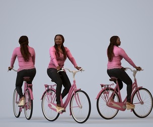 00310_Theresia022 Adult Black woman cycling through public space in transitional seasonal attire