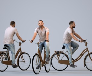 00315_Adil012 Adult Middle Eastern man cycling through public space in summer attire