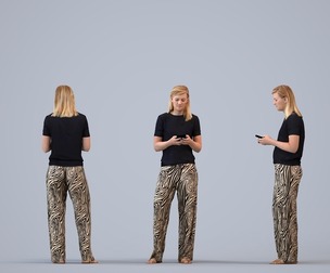 00368_Sophie005 Adult Caucasian woman standing at home with smartphone in transitional attire
