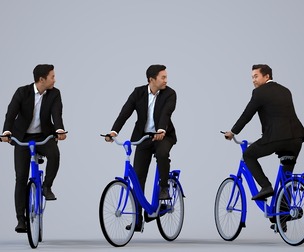 00384_Mansur011 Adult Asian male cycling through public space in business attire
