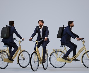 00399_Simon019 Adult Middle Eastern man cycling through public space with business bag