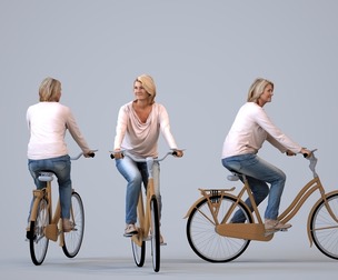 00406_Noelle001 Adult Caucasian woman cycling through public space in autumn or spring attire