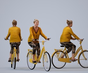 00412_Noelle011 Adult Caucasian woman cycling through public space in transitional seasonal attire