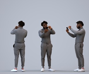 00477_Aaron009 Adult Black man standing at home with smartphone in transitional seasonal clothing