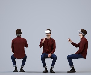 00499_Liam011 Adult Caucasian man sitting casually at home wearing VR headset, transitional clothing