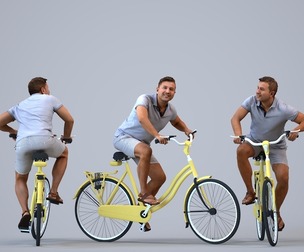 00569_Omar012 Adult Middle Eastern man cycling through public space in summer casual wear