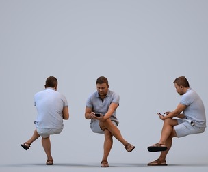 00569_Omar007 Adult Middle Eastern man sitting casually with smartphone in public space